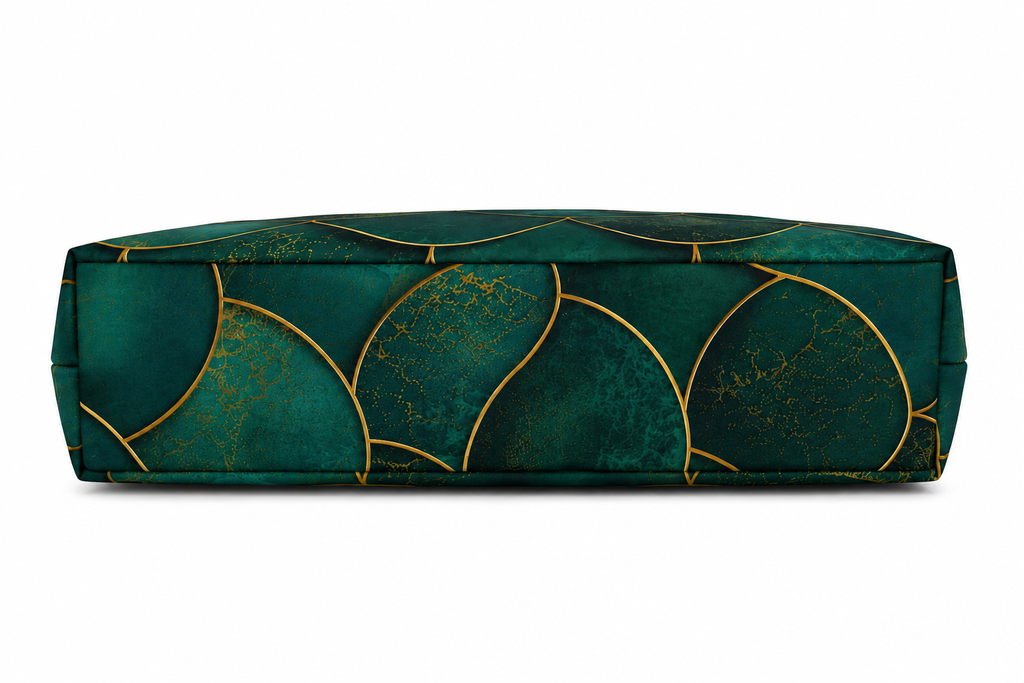 A rectangular floor cushion with a deep emerald green velvet fabric and a metallic gold scalloped geometric pattern, shown against a plain white background.