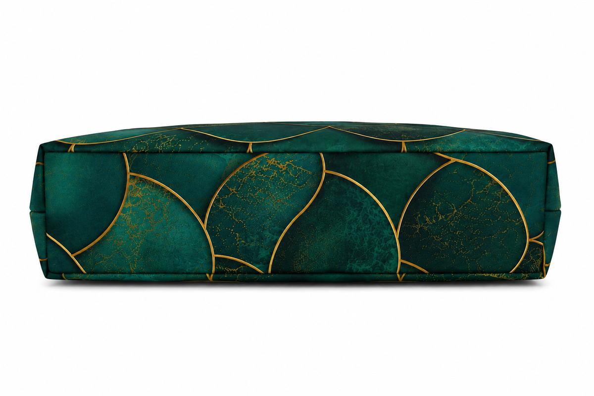 A rectangular floor cushion with a deep emerald green velvet fabric and a metallic gold scalloped geometric pattern, shown against a plain white background.